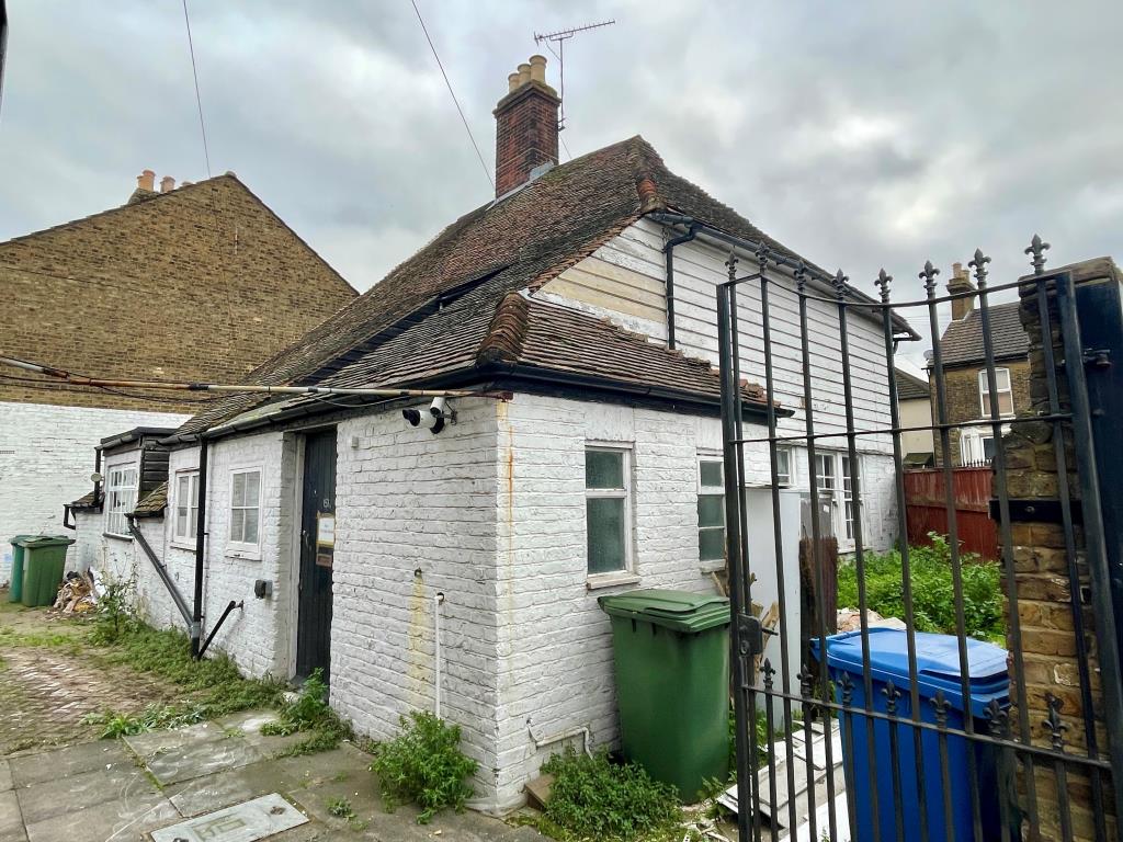 Lot: 136 - COTTAGE WITH IMPROVEMENT WORKS REQUIRING FINISHING - Rear of cottage